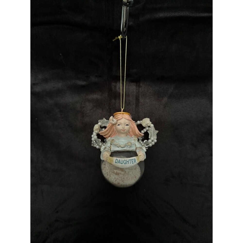 Grassland Road decorative angel above clear ball with sand, says” daughter” .